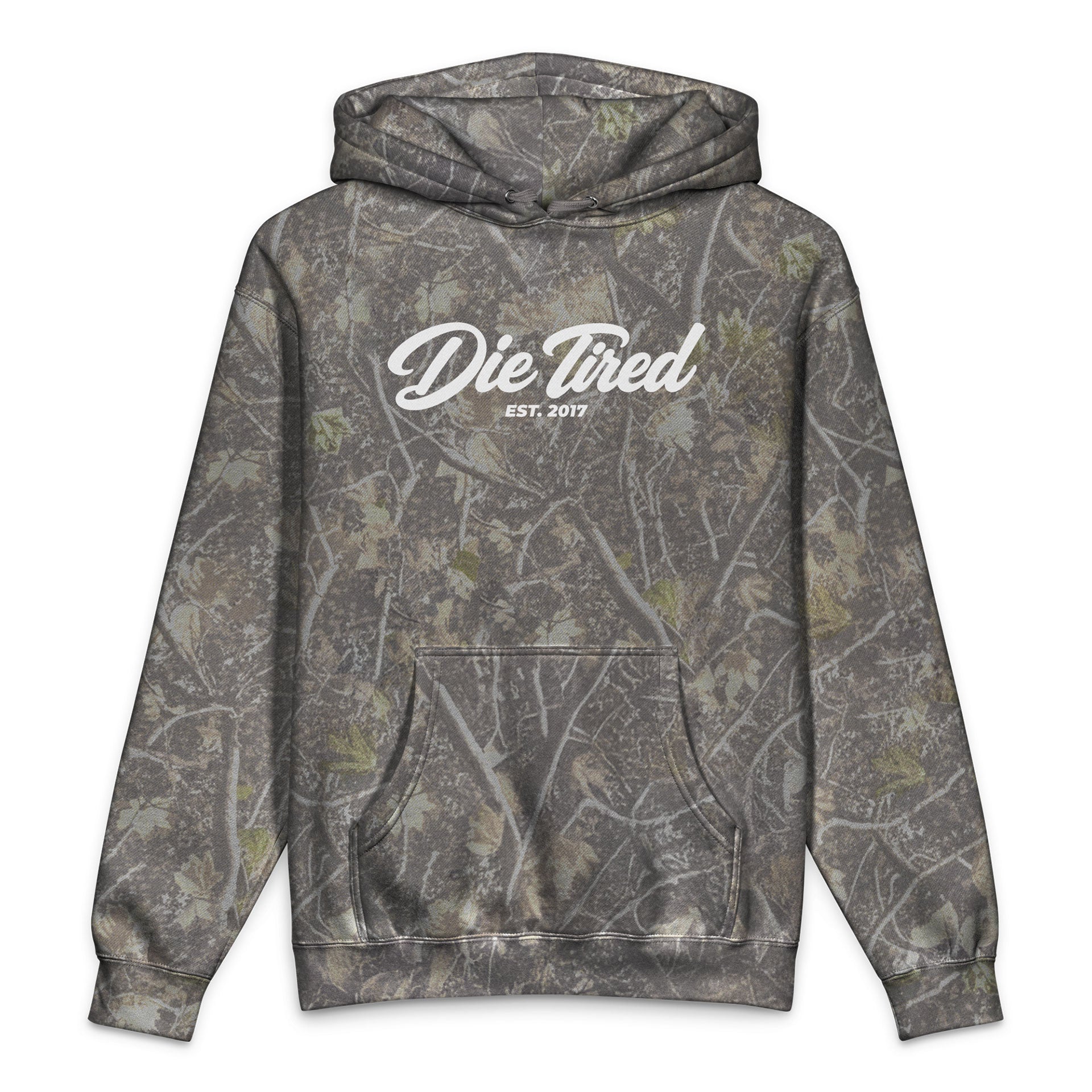 A long-sleeve pullover hoodie with a gray and brown tree bark camouflage pattern, featuring a white script graphic on the chest that reads 'Die Tired EST. 2017'.