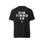 Black t-shirt with 'Die Tired Co' text on the back against a white background