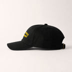 Black cap with yellow text on a white background